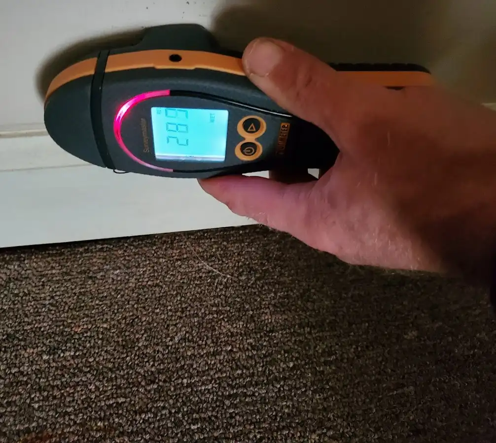 Moisture detection at baseboard during Sewage Cleanup & Sanitation in Florence-Graham